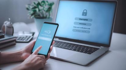 Woman hand enter a one time password for the validation process, Mobile OTP secure Verification Method, 2-Step authentication web page.