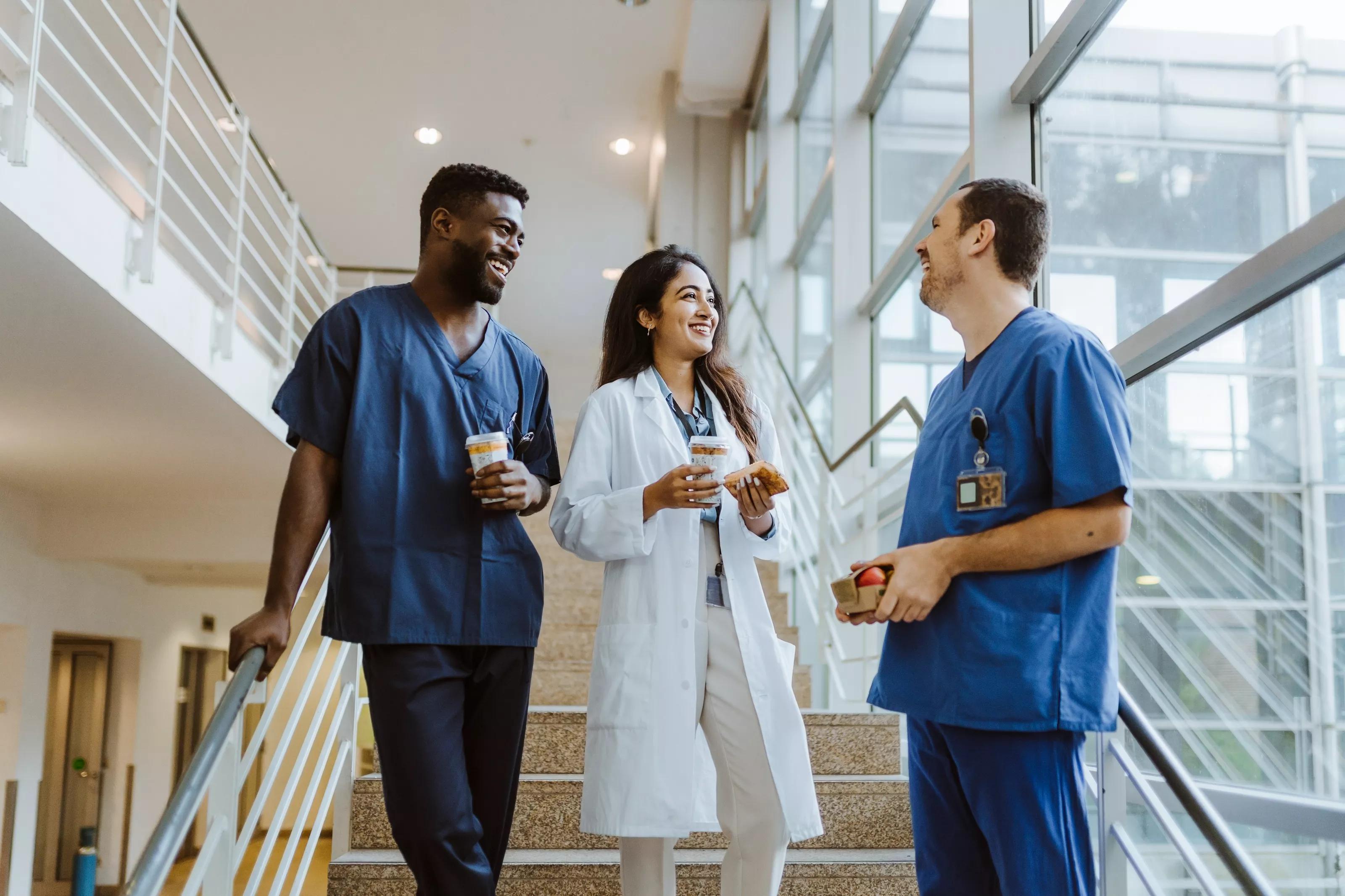 Medical Team Talking by Staircase