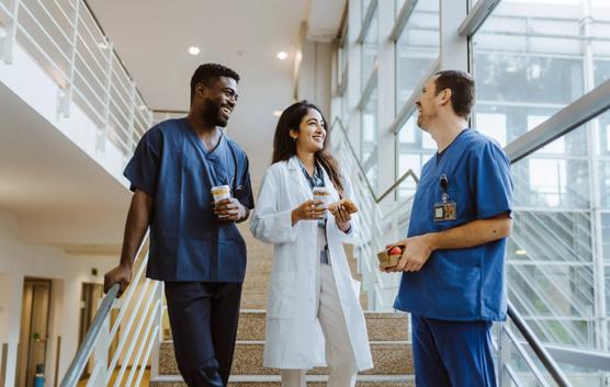 Medical Team Talking by Staircase