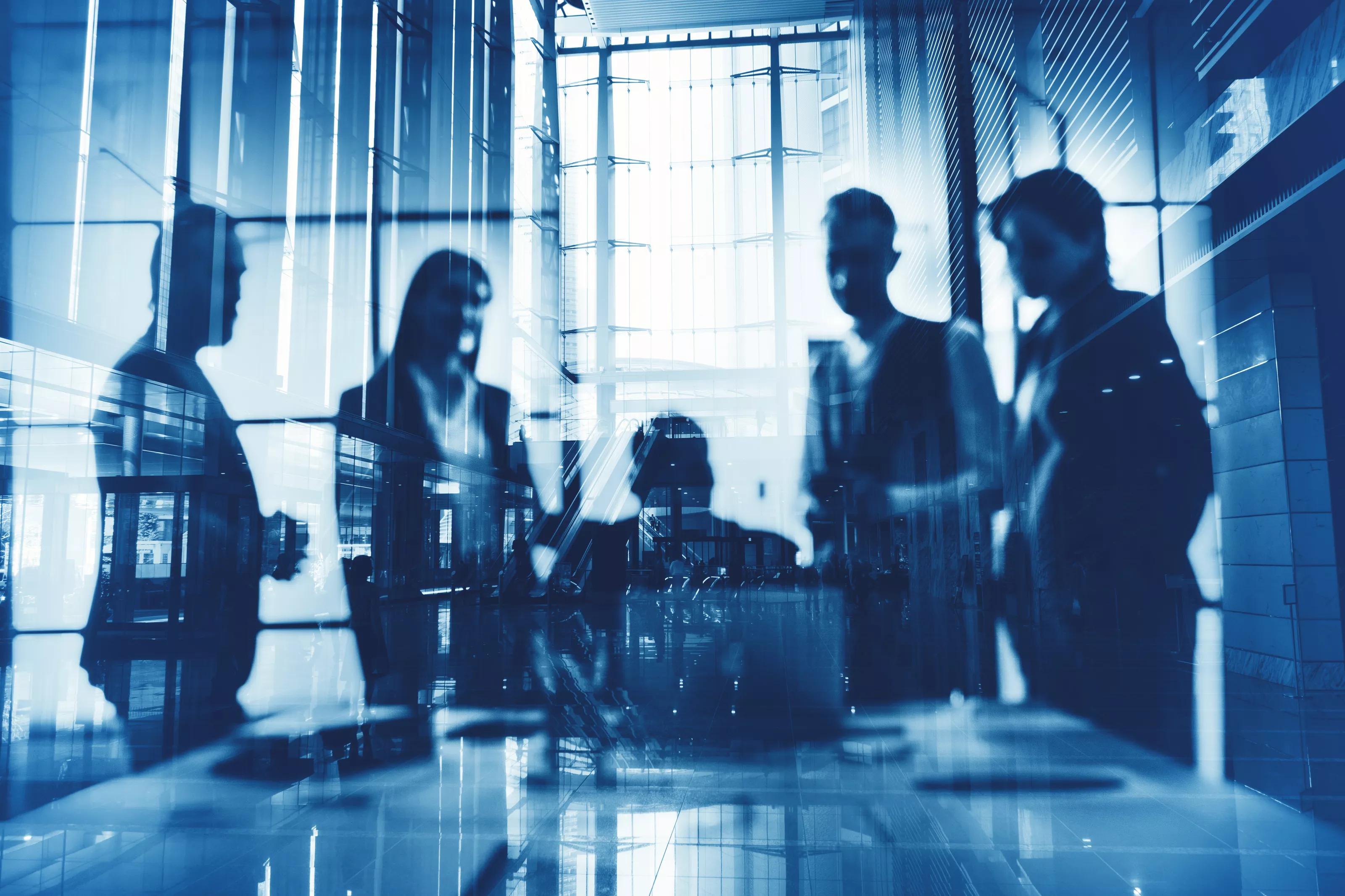 Double exposure of business people who work together in office