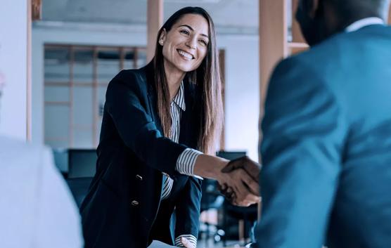 Woman Handshaking Business Partner