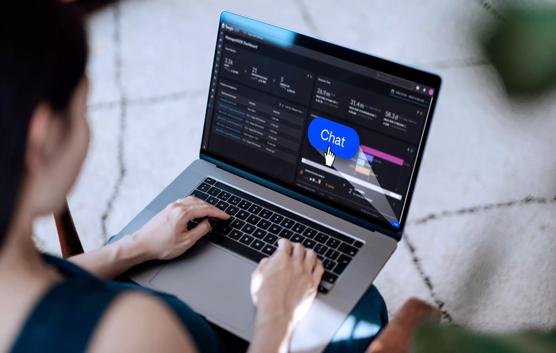 Mockup image of a young Asian woman using computer with blank screens at the office. Blank screen template mock up. Over the shoulder view.