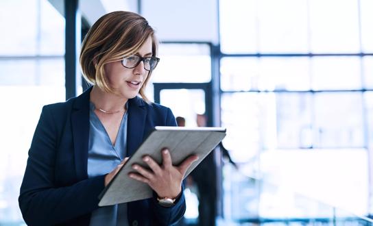 Woman With Glasses Using Large Digital Tablet