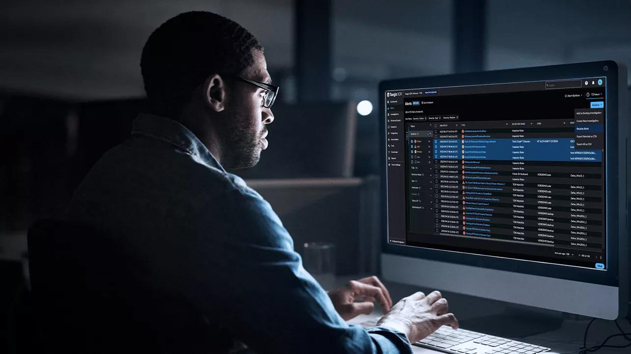 Man Using Taegis on Computer