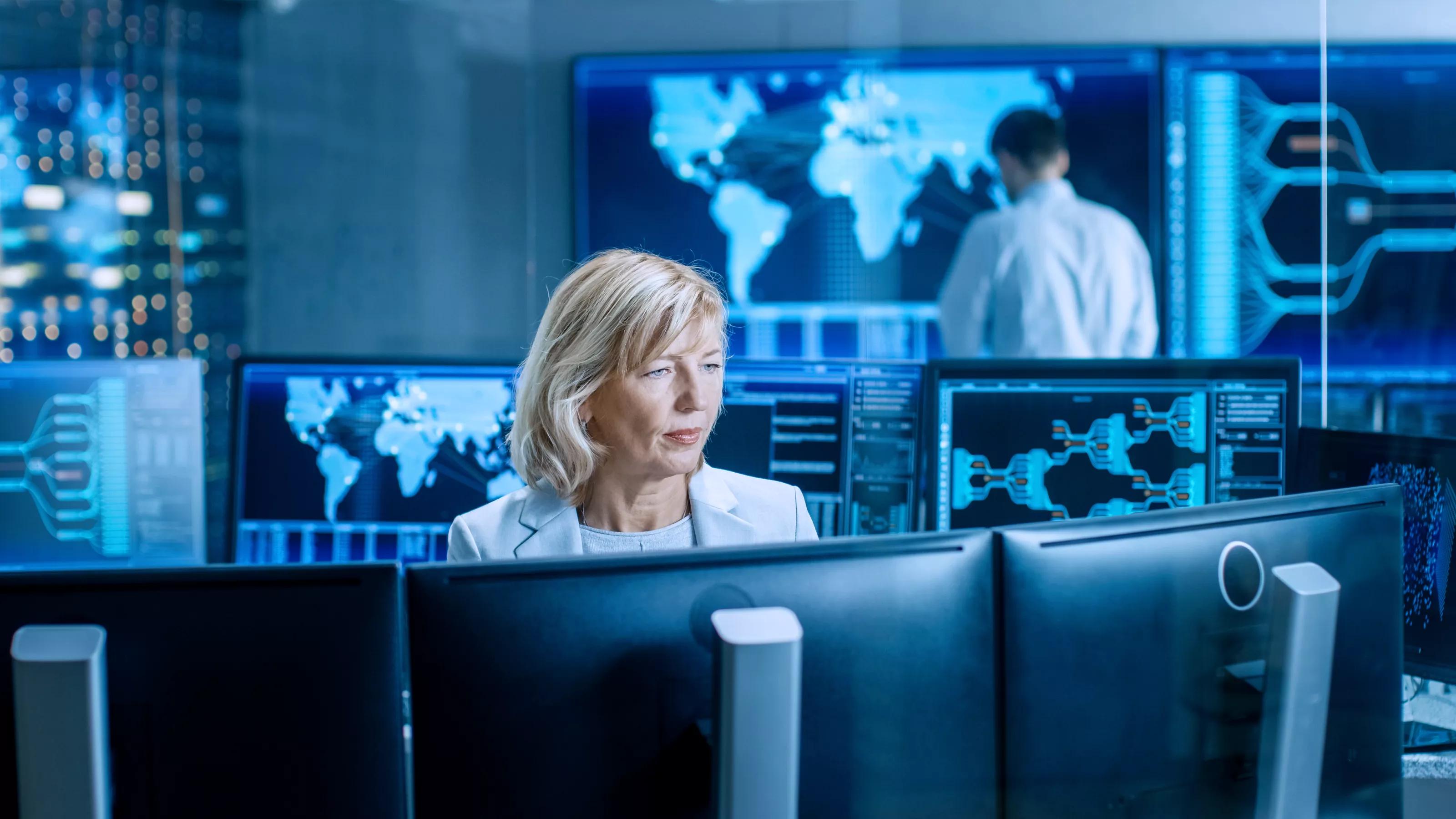Woman Working at a System Monitoring Room
