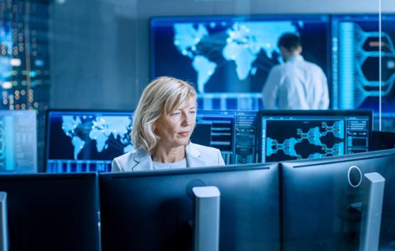 Woman Working at a System Monitoring Room